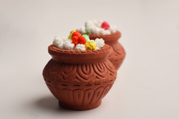 Indian festival makar sankranti concept : Tilgul in small bowl. Tilgul is a colourful sesame candy coated with sesame seeds; in Maharashtra people exchange tilgul on Sankranti