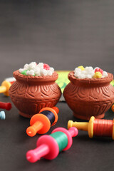Indian festival makar sankranti concept : Tilgul in small bowl. Tilgul is a colourful sesame candy coated with sesame seeds; in Maharashtra people exchange tilgul on Sankranti