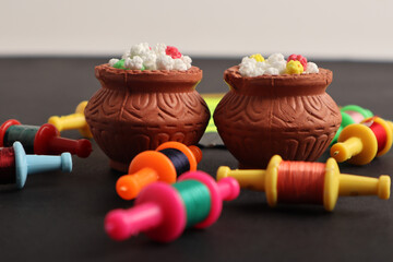 Indian festival makar sankranti concept : Tilgul in small bowl. Tilgul is a colourful sesame candy coated with sesame seeds; in Maharashtra people exchange tilgul on Sankranti