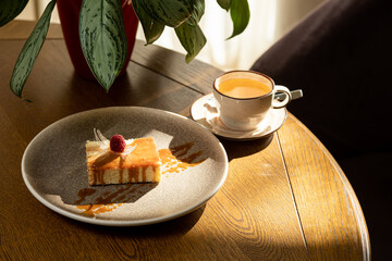 airy dessert decorated with raspberries, served with tea, dessert in the interior
