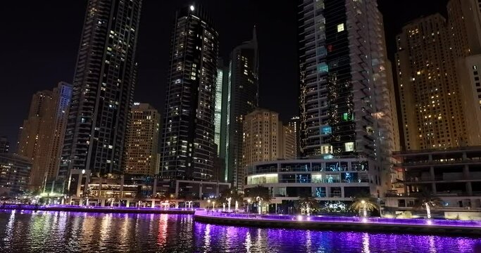 Dubai, United Arab Emirates. Night trip of Dubai Marina is a district in Dubai, United Arab Emirates