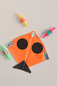 Colorful paper kite for Indian festival Makar Sankranti over white background.