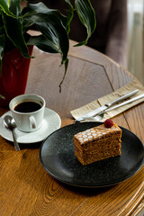 dessert decorated with raspberries, served with coffee. Photo of dessert in the interior