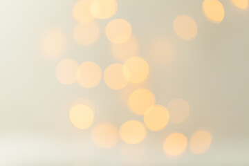 Bokeh lights background. Christmas lights on white background. Yellow light rings