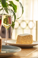 delicious dessert napolon served with champagne. photo of dessert in the interior.