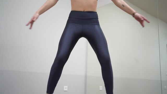 athletic girl are engaged in jumping on sports trampoline Video HD Slow motion
