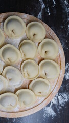 dumplings, a traditional dish of Russian cuisine, made of dough stuffed with minced meat, minced meat, cooking process, modeling, recipe