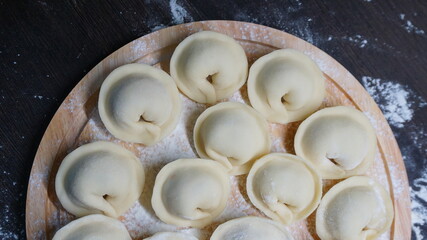 dumplings, a traditional dish of Russian cuisine, made of dough stuffed with minced meat, minced meat, cooking process, modeling, recipe