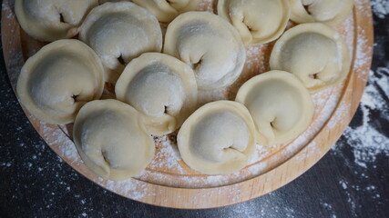 dumplings, a traditional dish of Russian cuisine, made of dough stuffed with minced meat, minced meat, cooking process, modeling, recipe
