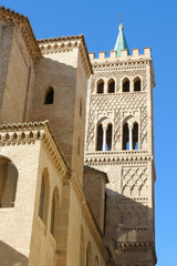 Fototapeta na wymiar Church tower made in Mudejar architectural style from outside in Zaragoza, Spain. Fort with moorish ornamental details