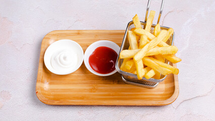 French fries basket and ketchup with mayonnaise