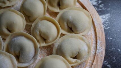 dumplings, a traditional dish of Russian cuisine, made of dough stuffed with minced meat, minced meat, cooking process, modeling, recipe