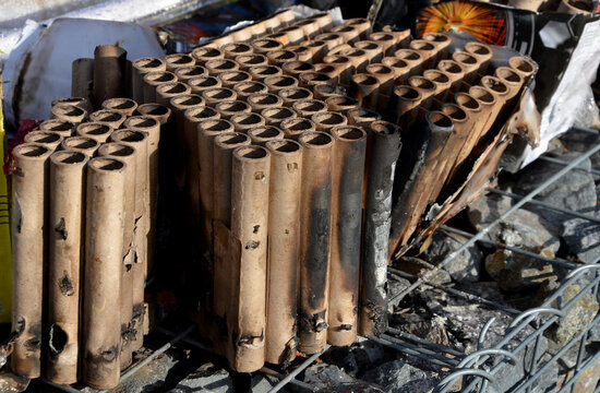 batteries of fired fireworks flares to celebrate the new year. For many weeks they did not clean the paper boxes used rollers, tubes, Roman candles and rocket pyrotechnics for entertainment. park