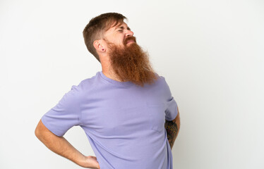 Fototapeta premium Young reddish caucasian man isolated on white background suffering from backache for having made an effort