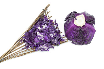 Purple cabbage on wicker isolated on white background top view.