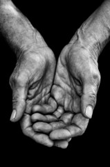 An elderly woman hands begging for food or help-Beggar and poverty concept, poor people, retirement pension.Black and white photo. Global financial crisic, hungry and no money background.