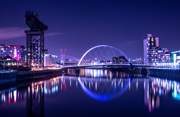 City Riverscape at Night with reflections and purple light