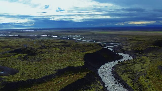 Flying over Iceland: river, rocks, slopes, hills, nature