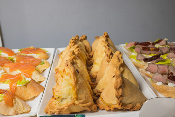 Triangular pies on a plate uchpochmak catering. © Евгений Вершинин