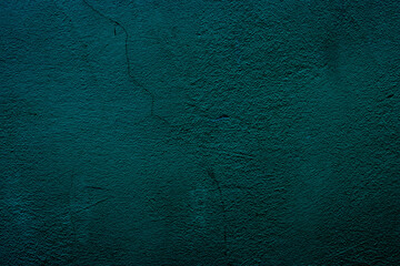 Petrol colored wall background with textures of different shades of teal