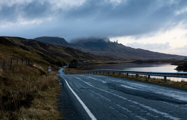 Looking toward the "old man of storr" Isle of Skye - Scottish highland road leading towards the view of the old man of storr - Loch Fada in the foreground