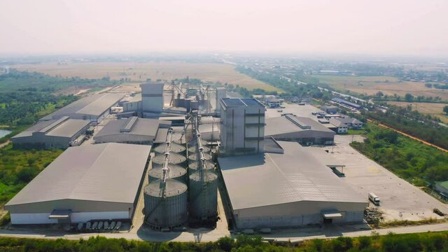 Aerial top view of factory industry. Electricity tower building in energy, transportation, logistic or environment concept. Manufacturing workshop station.