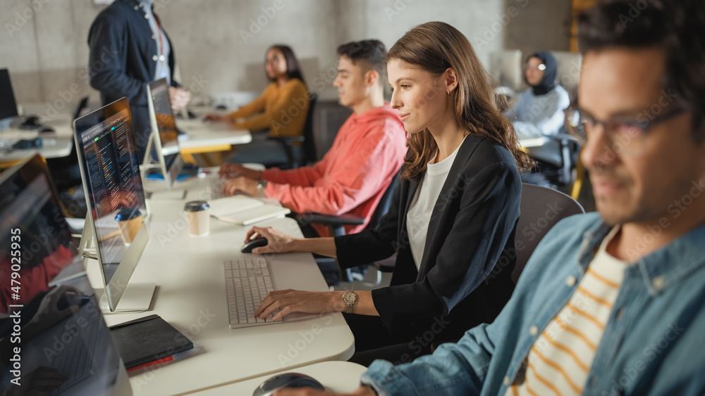 Aufkleber diverse multiethnic group of female and male students sitting in college room, learning computer sci