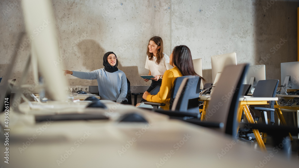Poster Diverse Multiethnic Group of Female Students Sitting Together in Infographics Room, Collaborating on a College Project. Young Feminists Talking About Creating Gender Equality Mobile Application.