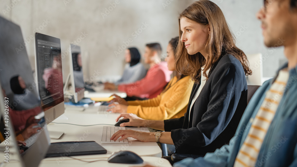 Aufkleber diverse multiethnic group of female and male students sitting in college room, learning computer sci