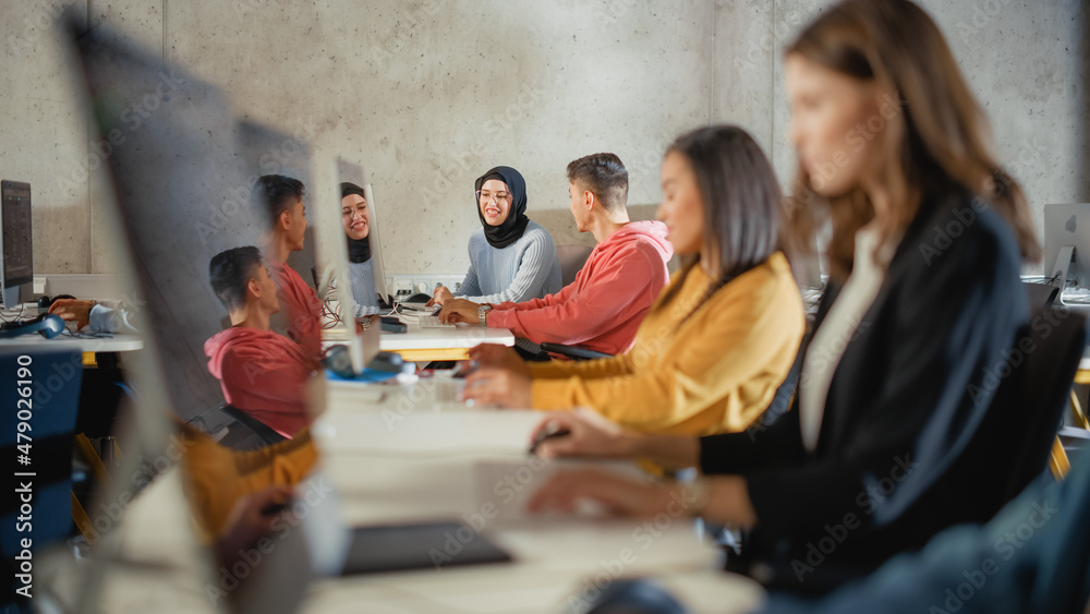 Aufkleber Smart Young Students Studying in University with Diverse Multiethnic Classmates. Scholars Collaborate in College Room with Computers. Applying Knowledge to Acquire Academic Skills in Class.