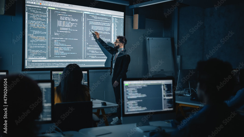 Aufkleber Teacher Giving Computer Science Lecture to Diverse Multiethnic Group of Female and Male Students in Dark College Room. Projecting Slideshow with Programming Code. Explaining Information Technology.
