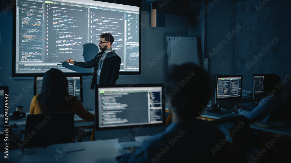 Aufkleber Teacher Giving Computer Science Lecture to Diverse Multiethnic Group of Female and Male Students in Dark College Room. Projecting Slideshow with Programming Code. Explaining Information Technology.