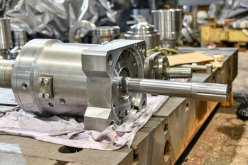 Ground cylinder of a hydraulic pump in a workshop being repaired.