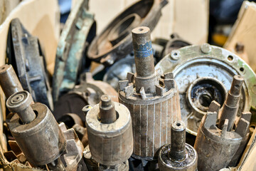 Disassembled rotor of old electric motors in a warehouse in a workshop.