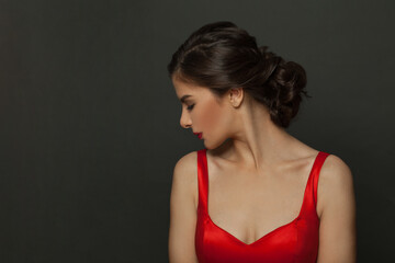 Fototapeta premium Stylish brunette woman profile. Beautiful lady with classic hairstyle on black background