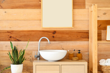Fototapeta na wymiar Interior of stylish bathroom with drawers, sink and mirror