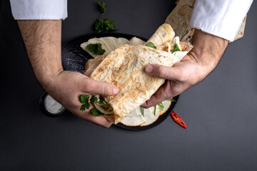 Cheese with herbs and sauce is put into pita bread. assorted Caucasian cheese with sauce, lavash and herbs