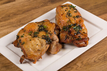 Roasted chicken thighs with spices  and herbs