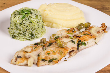 Belle Meuniere fish fillet, served with mashed potatoes and rice with broccoli