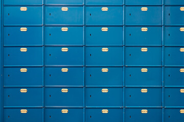 Postcode lockers in blue and plate with the identification number - obrazy, fototapety, plakaty