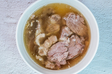 Galbitang, Korean style beef Short Rib Soup : Beef ribs, soaked in cold water to remove the blood, and white radish chunks simmered together until tender. The clear stock is rich and savory, and the t