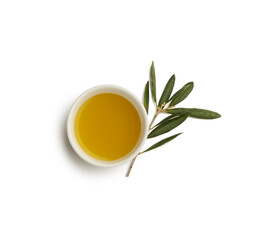 Obraz na płótnie Canvas small cup of olive oil and olive sprig, top view isolated on white background