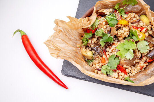 oxtails with ptim and vegetables wrapped in craft paper
