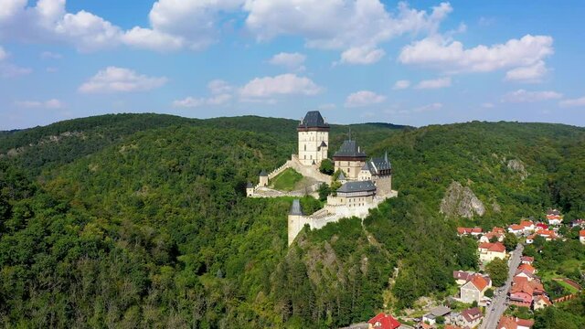 Royal Castle Karlstejn. Central Bohemia, Karlstejn village, Czechia. Aerial view to The Karlstejn castle. Royal palace founded King Charles IV. Amazing gothic monument in Czech Republic, Europe.
