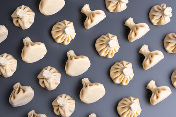 patern with khinkali on a dark background. traditional Caucasian cuisine