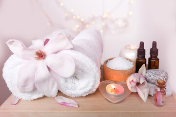 oil, tincture, salt, towel, gifts of nature, dietary supplements, magnolia flowers, spa procedure concept, natural medicine