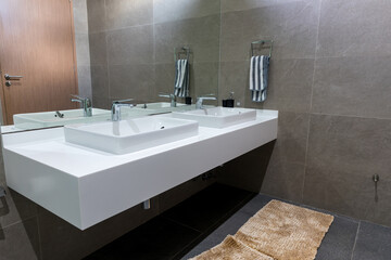 Chrome tap bathroom and dust on the surface do not clean and sensor for automatic open and close water supply. Ceramic sink and modern automatic tap in stylish pubic toilet.