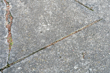 Old worn and cracked asphalt with cracks. Road surface texture background. cracks in the asphalt in the city