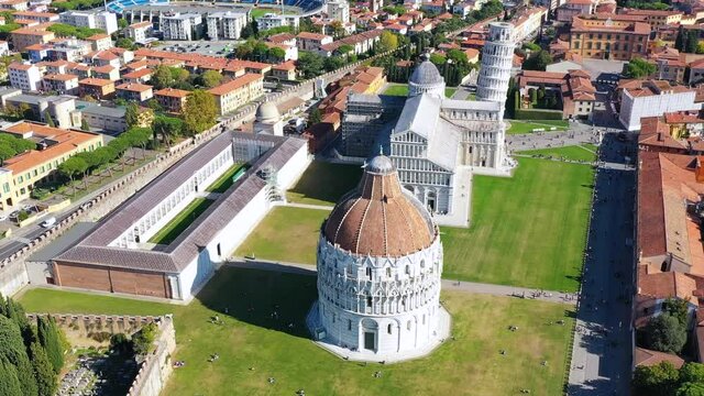 Pisa Cathedral and the Leaning Tower in a sunny day in Pisa, Italy. Pisa Cathedral with Leaning Tower of Pisa on Piazza dei Miracoli in Pisa, Tuscany, Italy.