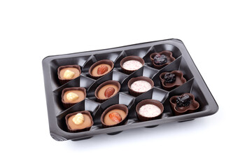 Chocolate candies in box isolated on white background